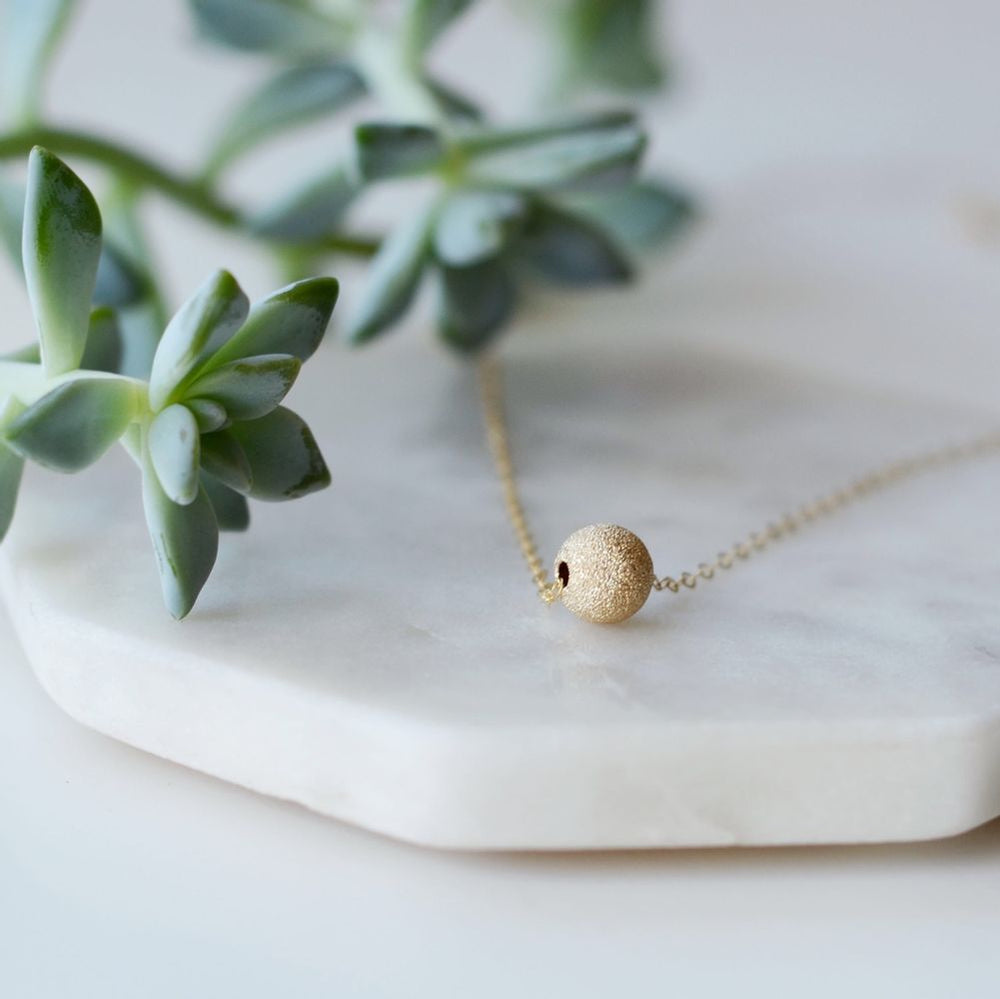 
                  
                    Tala Necklace
                  
                